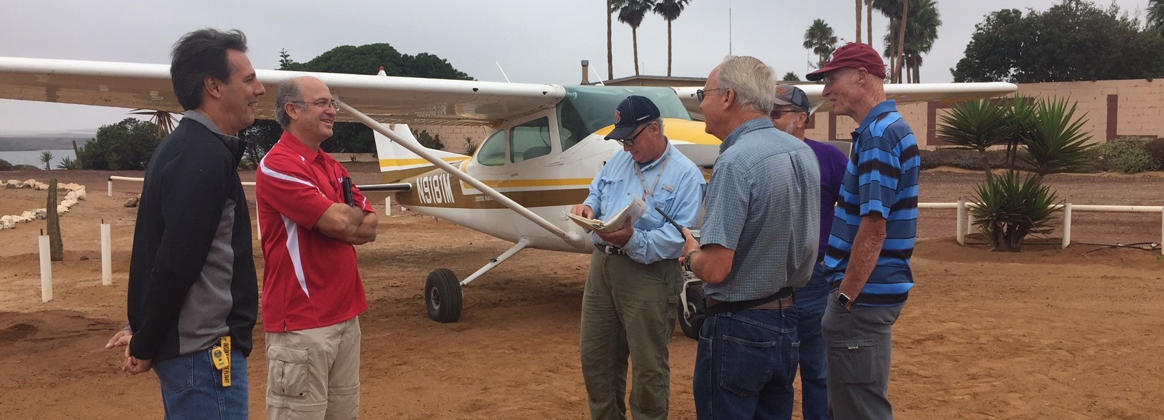 CALO team standing near airplane